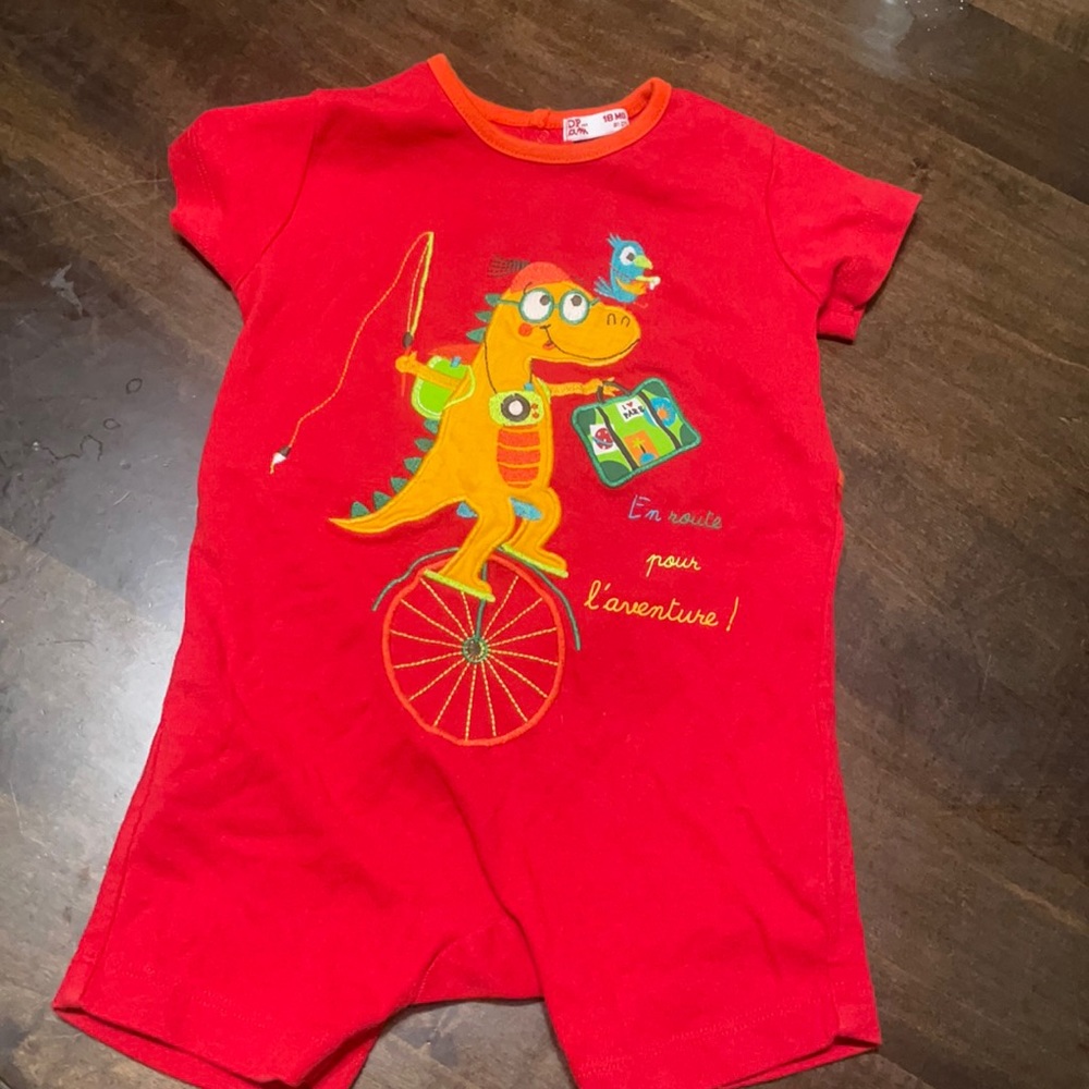 Cutest one piece UEC with butt window red bought in Paris model with a dinosaur